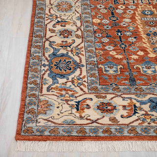 Traditional Persian style hand-knotted rug with paradise garden and tree-of-life motifs in rust and ivory.