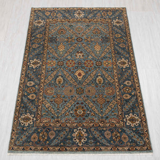 Traditional hand-knotted rug in blue, gold, and rust with lattice Persian floral design, 4x6 size.