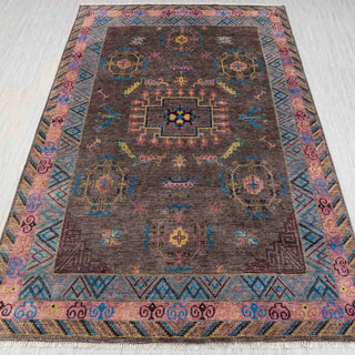 “Traditional hand-knotted rug in brown, pink, blue with colorful Oushak medallion design, 9x12.