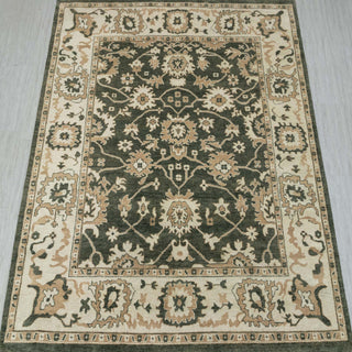 Traditional hand-knotted rug in forest green, ivory, camel with bold Oushak floral design, 10x14.