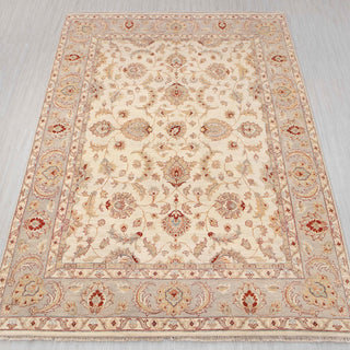 Traditional hand-knotted rug in ivory, beige, and soft gray with allover floral design, 8x10 size.