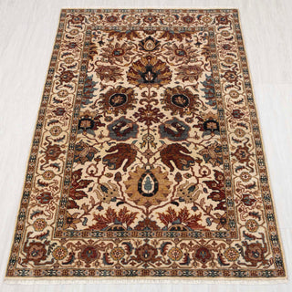 Traditional hand-knotted rug in ivory, rust, and teal with classic Persian floral design, 4x6 size