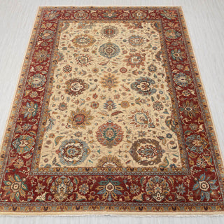 Traditional hand-knotted rug in ivory, rust, and teal with detailed allover floral design, 9x12 size