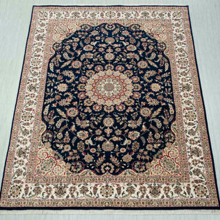 Traditional hand-knotted rug in navy and ivory with floral medallion design, ideal 8x10 area