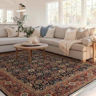 Traditional hand-knotted rug in navy, rust, and beige with dense floral design, classic 8x10 area size