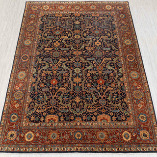 Traditional hand-knotted rug in navy, rust, and beige with intricate geometric Persian design
