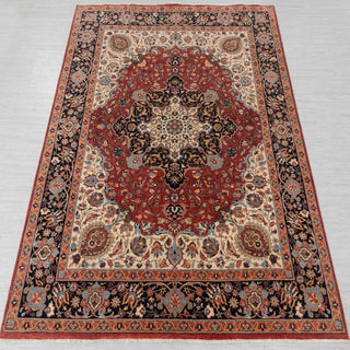 Traditional hand-knotted rug in red, ivory, and navy with grand Persian medallion design, classic 8x10 size