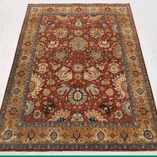Traditional hand-knotted rug in rust, gold, and blue with classic Persian floral design, 8x10 size.