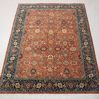 Traditional hand-knotted rug in rust, navy, and ivory with dense Persian floral design, 10x14 size