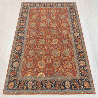 Traditional hand-knotted rug in rust, navy, and teal with intricate Persian floral design, 6x9 size