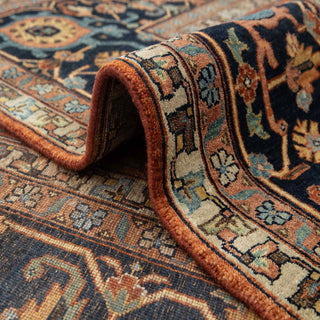 Traditional oriental hand-knotted wool rug, rust background, navy floral border, room-size 10x14