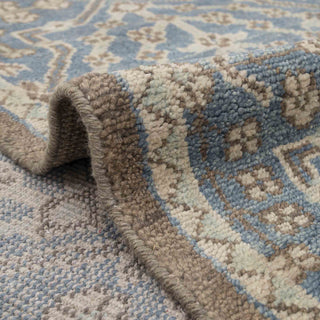 Transitional Moroccan-Persian style hand-knotted rug with lattice tree pattern in misty blue and ivory tones.
