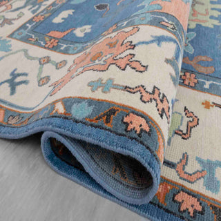 Turkish-style Oushak hand-knotted rug with bright blue field, ivory border and multicolor abstract floral motifs, large 8x10 carpet