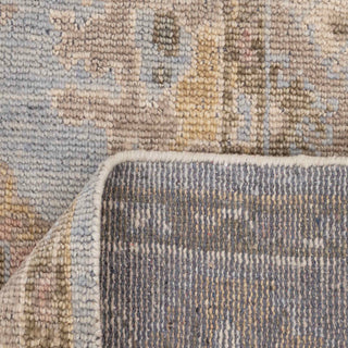 Turkish-style Oushak hand-knotted rug with light blue center, camel border, faded floral motifs, large 8x10 living room carpet