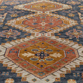 Turkish-style hand-knotted rug with geometric medallion motifs in deep blue, gold, and terracotta tones.