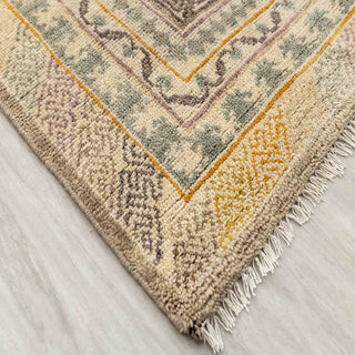 Turkish Oushak-style hand-knotted rug with geometric floral motifs in sand, saffron, pistachio tones, 9x12