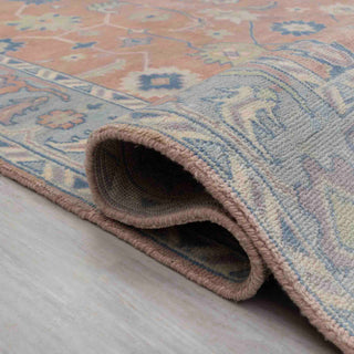 Turkish Oushak-style hand-knotted rug with large geometric floral motifs in peach and pastel blue