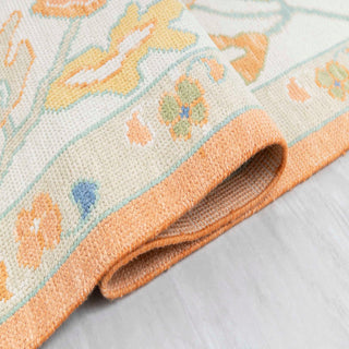 Turkish Oushak-style hand-knotted rug with large tribal floral motifs in apricot, cream, pastels, 9x12