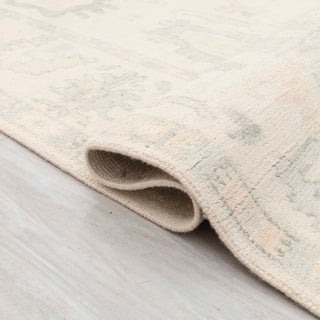 Turkish Oushak-style hand-knotted rug with neutral floral motifs in ivory and light taupe tones, 8x10