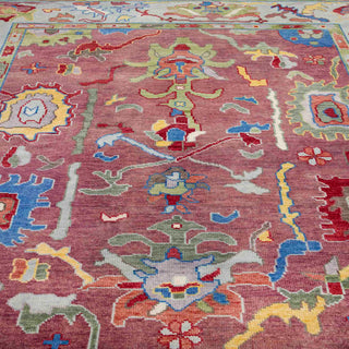 Turkish Oushak-style hand-knotted rug with palmette and leaf motifs in rose, aqua, gold and green