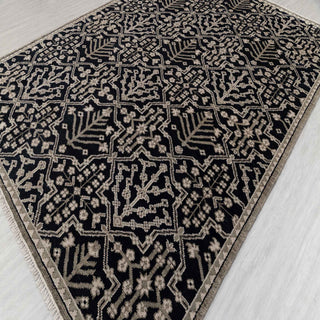 Turkish Oushak-style hand-knotted rug with tribal floral motifs in black and sand tones, 8x10