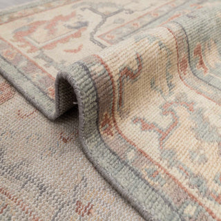 Turkish Oushak hand-knotted rug with palmette and vine motifs in soft green, ivory, rust tones, 8x10