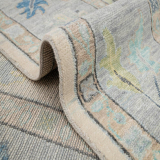 Turkish Oushak hand-knotted rug with soft floral motif in ivory, sky blue, teal and grey tones, 10x14.