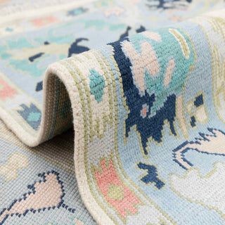 Turkish Oushak hand-knotted rug with tribal floral motifs in ivory, blue, sage, coral tones, 8x10