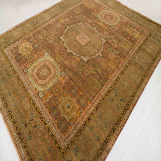 Turkish Oushak hand-knotted rug with vintage geometric motif in soft green, terracotta, beige.