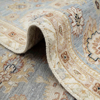 Turkish/Pakistani Oushak hand-knotted rug with traditional floral medallion motifs in ivory, denim blue and soft gold