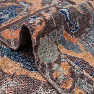 Wool hand-knotted area rug in dark neutral palette with teal and rust pattern, 8x10, low pile for living room.