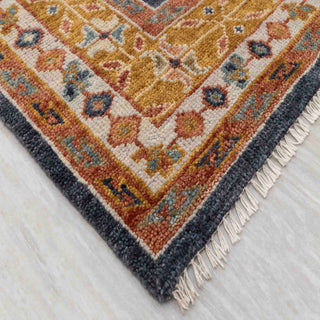 Wool hand-knotted area rug in navy and warm earth tones, 8x10, soft low pile for living room decor