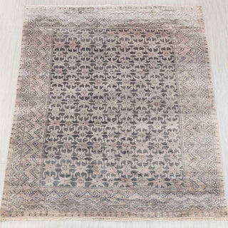Wool hand-knotted rug in grey and taupe with repeating tribal floral design, 8x10.