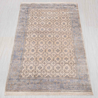 Wool hand-knotted rug in ivory and blue-grey with lattice medallion design, 6x9.