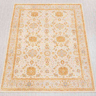 Wool hand-knotted rug in ivory, gold, and beige with allover floral medallion design, 8x10.

