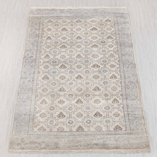 Wool hand-knotted rug in ivory, grey, and taupe with lattice medallion design, 6x9.