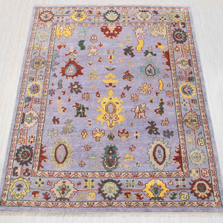 Wool hand-knotted rug in lavender, yellow, and teal with playful Oushak design, 8x10.