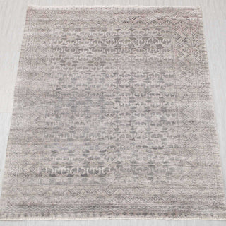 Wool hand-knotted rug in soft grey and taupe with subtle tribal pattern, 8x10.