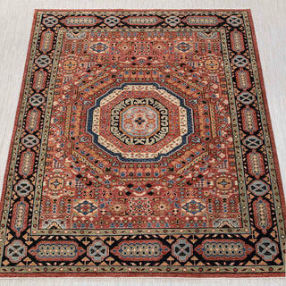 Wool hand-knotted rug in terracotta, navy, and ivory with octagon medallion design, 9x12.