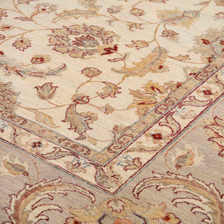 Ziegler style hand-knotted rug with scrolling floral motif in cream, light gray, and terracotta tones
